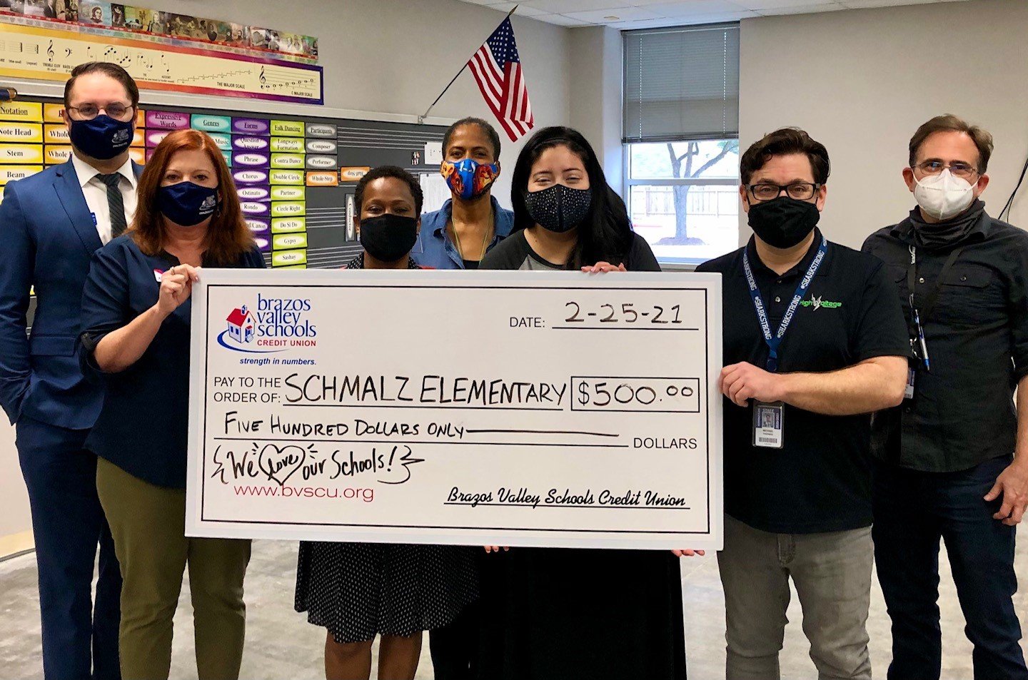 BVSCU staff present Schmalz Elementary School Principal Charlotte Gilder (third from left) with a check for $500 to support the recovery of the school’s music program after burst pipes caused damage to the campus the week of Feb. 14.